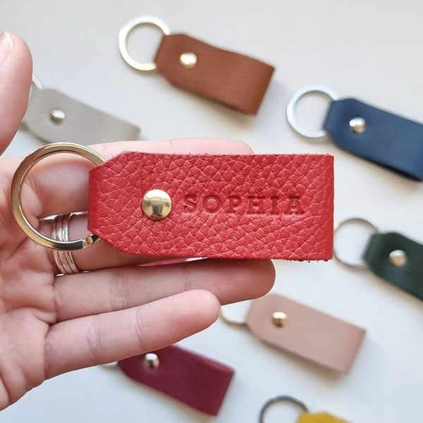 Close-up of brown leather keyring with initials, designed for her