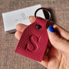 Minimalist brown leather keychain with initials, handcrafted by leathergoods43