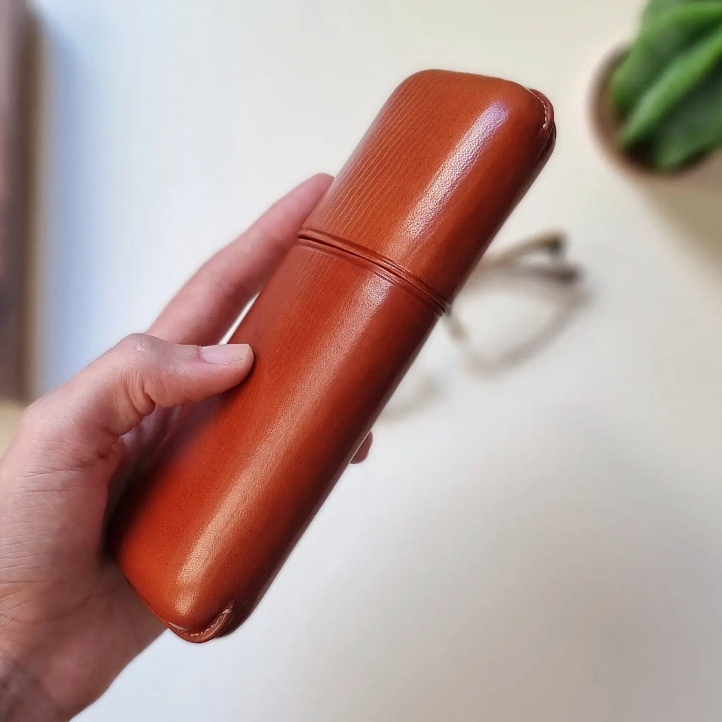 Close-up of a handmade leather eyeglass case by leathergoods43 with secure snap closure


