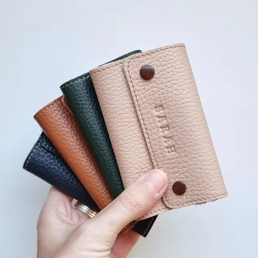 Close-up of compact key pouch with personalized engraving, suitable for her or him