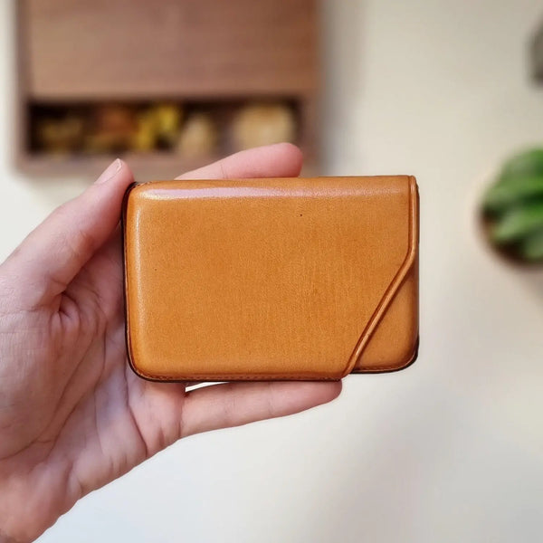 Minimalist leather card sleeve with custom engraving for men, ideal for gifting